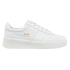 White Gola trainer with orange branding on the side and heel
