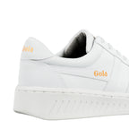 Close up of the heel and side of a white Gola trainer with gold branding