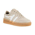 Beige suede Gola trainer with white side stripes and a gum rubber sole