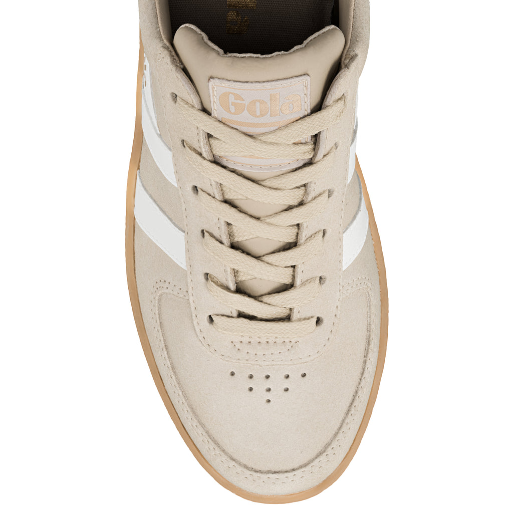 Top view of a beige suede Gola trainer with white side stripes and a gum sole