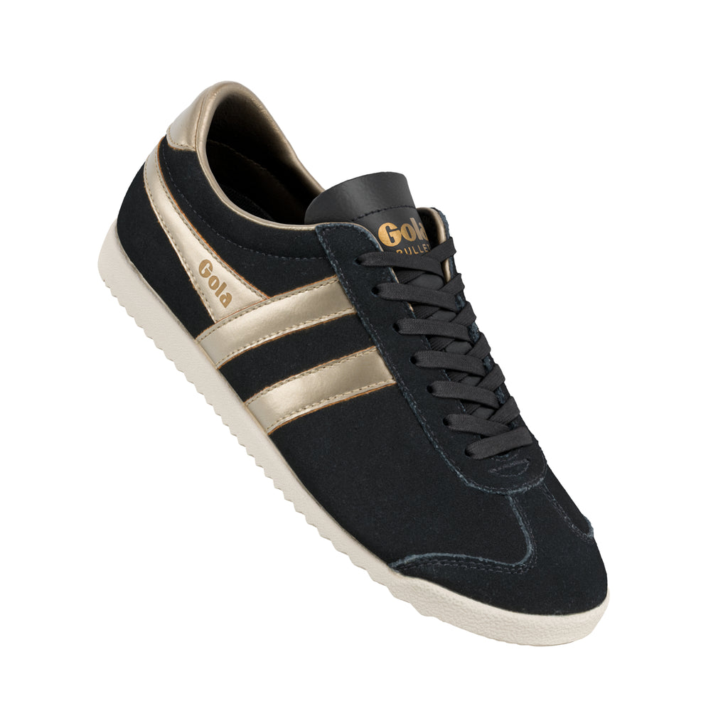 Black suede Gola trainer with metallic gold side stripes and white sole