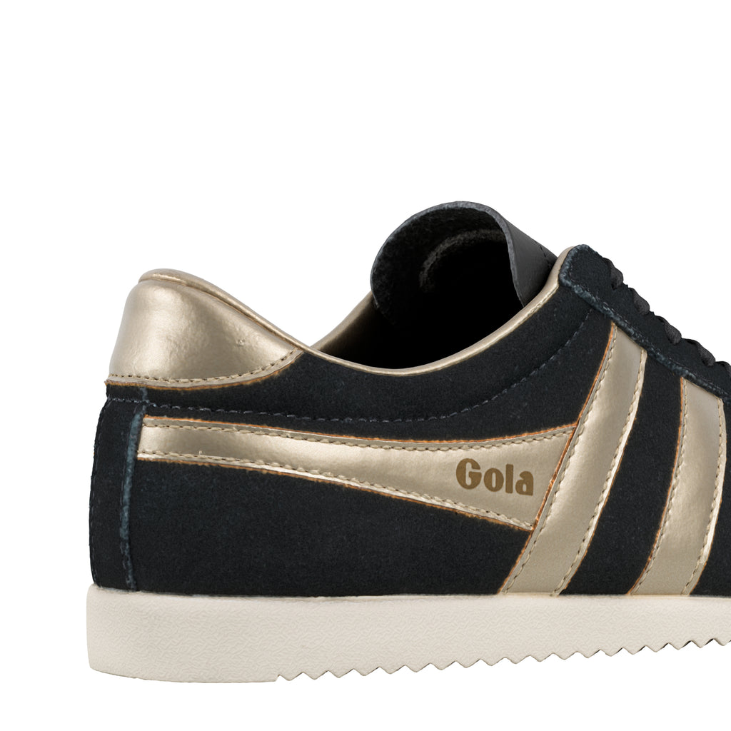 Black suede Gola trainer with metallic gold side stripes and heel tab