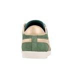 Rear view of a green suede trainer with gold detailing and a white sole