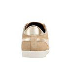Rear view of a beige suede trainer with gold metallic heel detail and white rubber sole