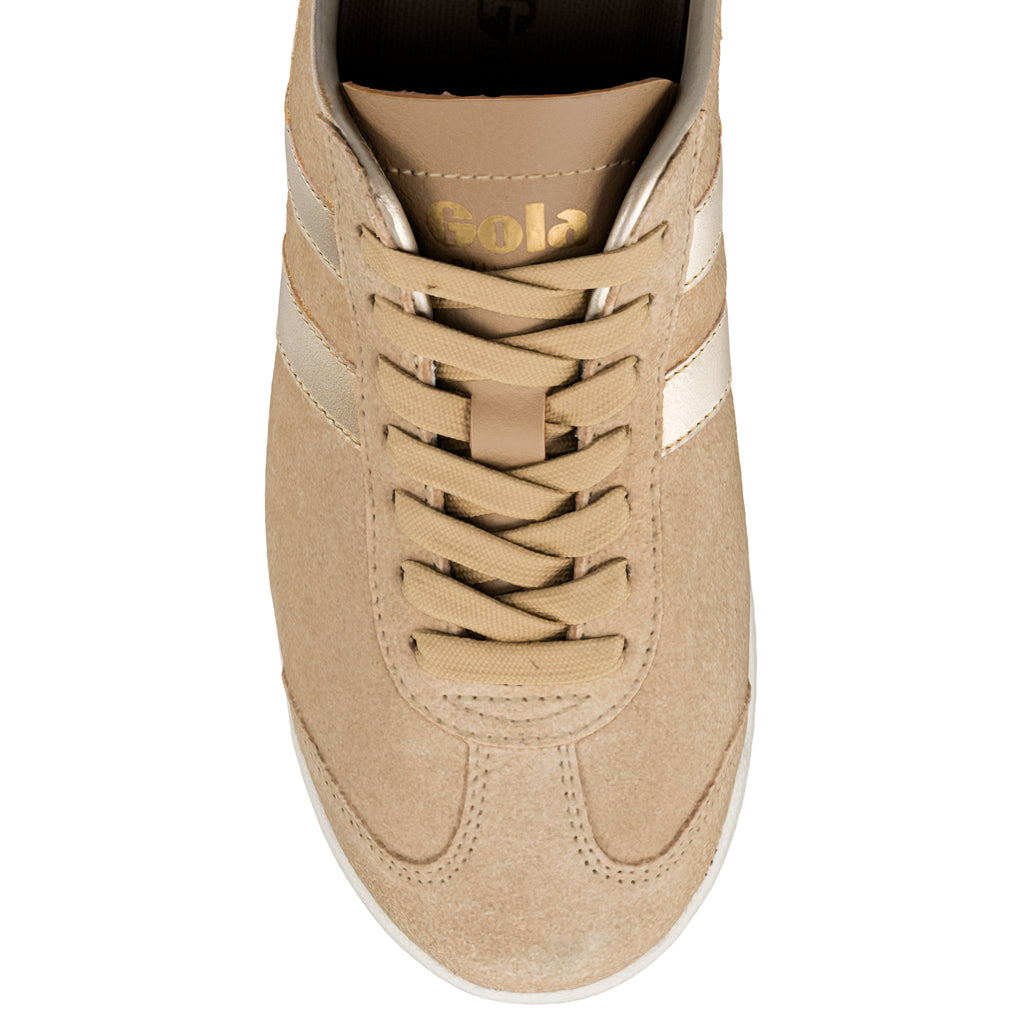 Top view of a beige suede Gola trainer with matching laces and metallic side stripes