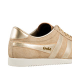Close up of a beige suede Gola trainer with metallic gold detailing