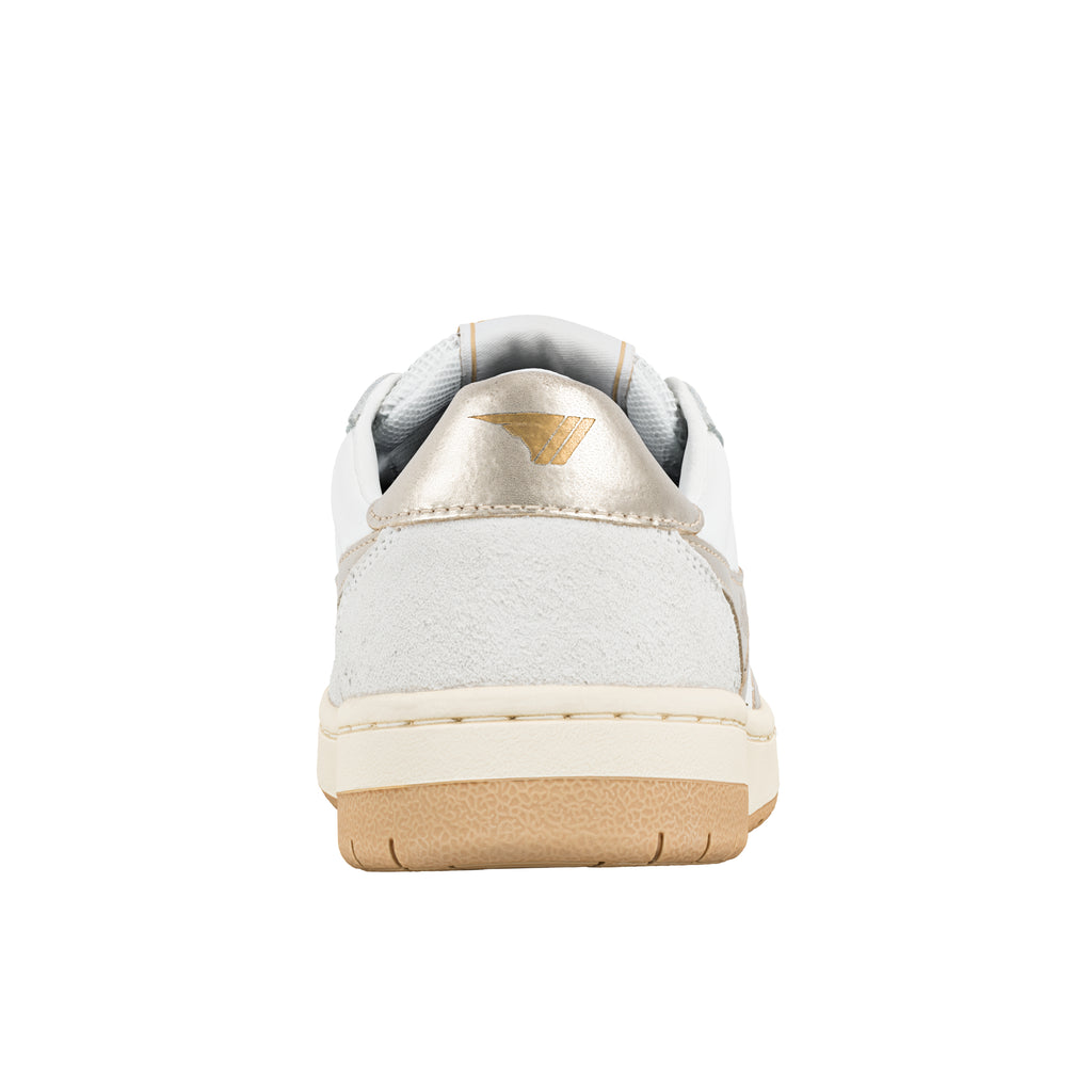 Rear view of a white trainer with a metallic gold heel tab and gum rubber sole