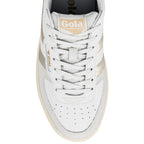 Top view of a white Gola trainer with metallic gold side stripes and lace up fastening