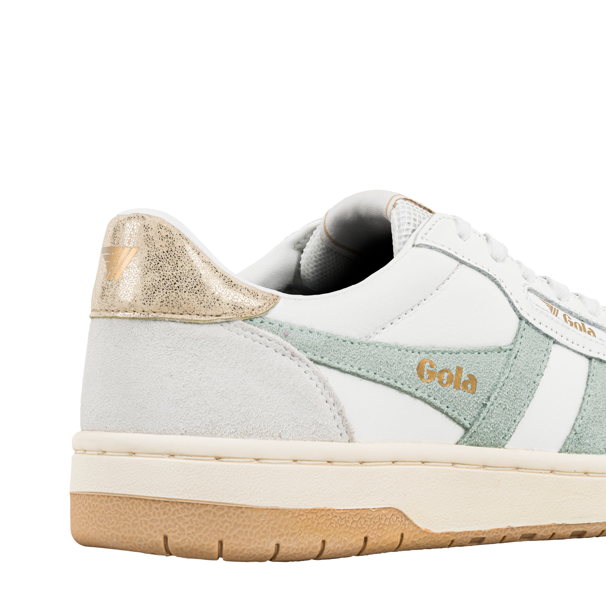 Close up of white and sage green Gola trainer with gold heel detail