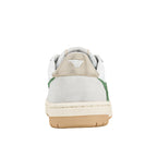 Rear view of a white and green trainer with a gum rubber sole