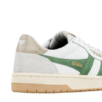 Close up of white Gola trainer with green suede side panel and gold metallic heel tab