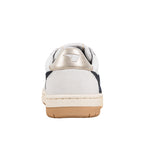 Rear view of a white and navy trainer with a metallic heel tab and gum rubber sole