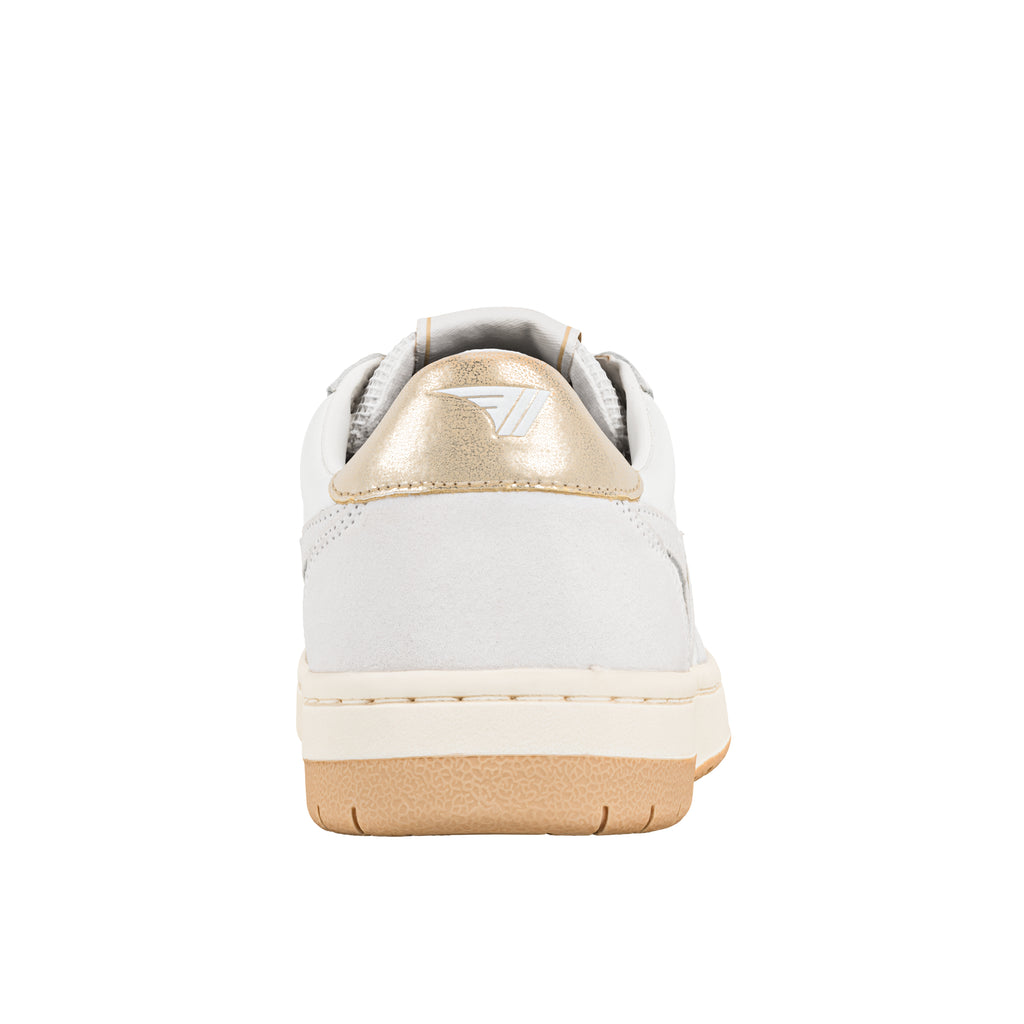 Rear view of white trainer with gold heel tab and gum rubber sole