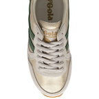 Top-down view of a gold and green Gola sneaker with white laces