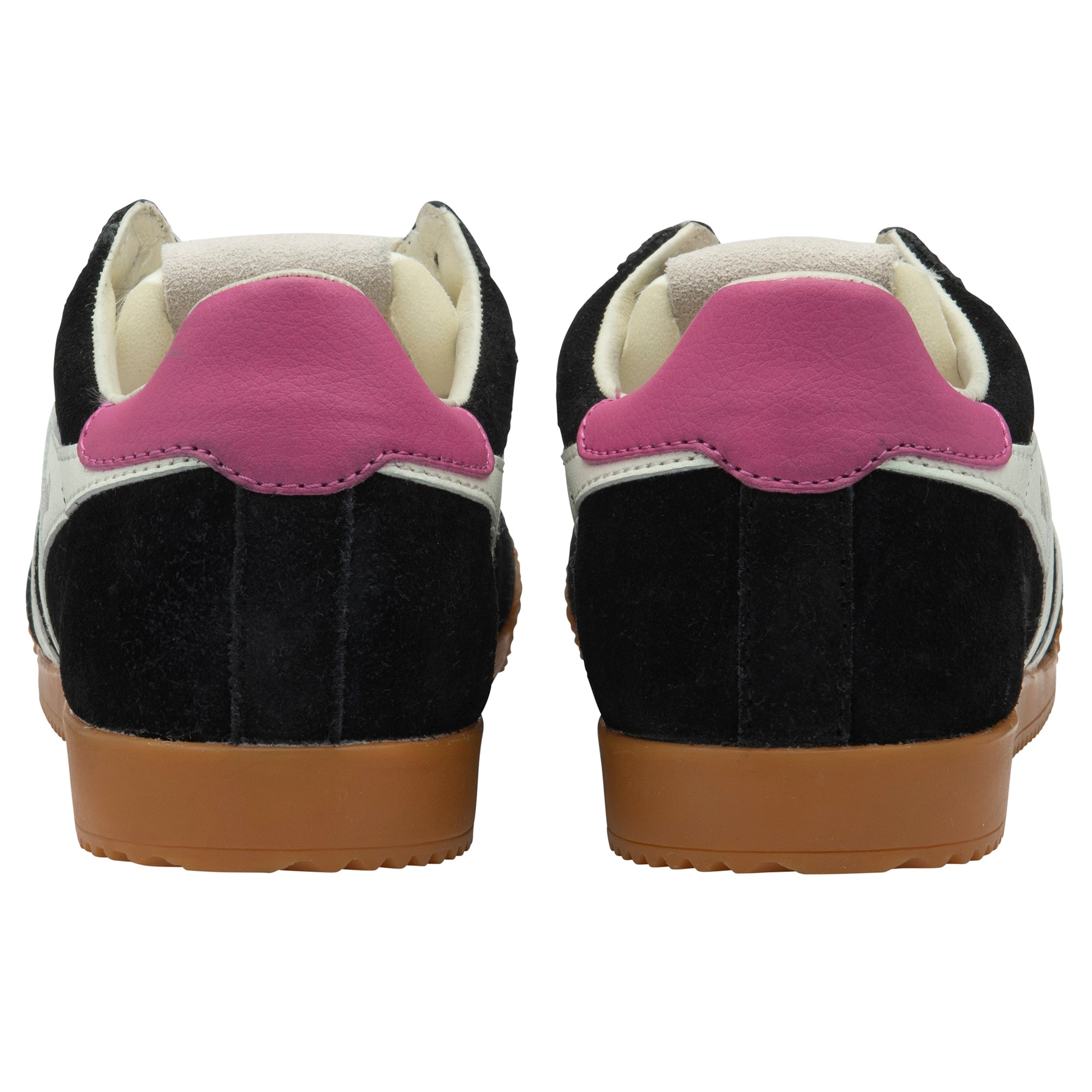Black and white trainers with pink heel tab on a white background