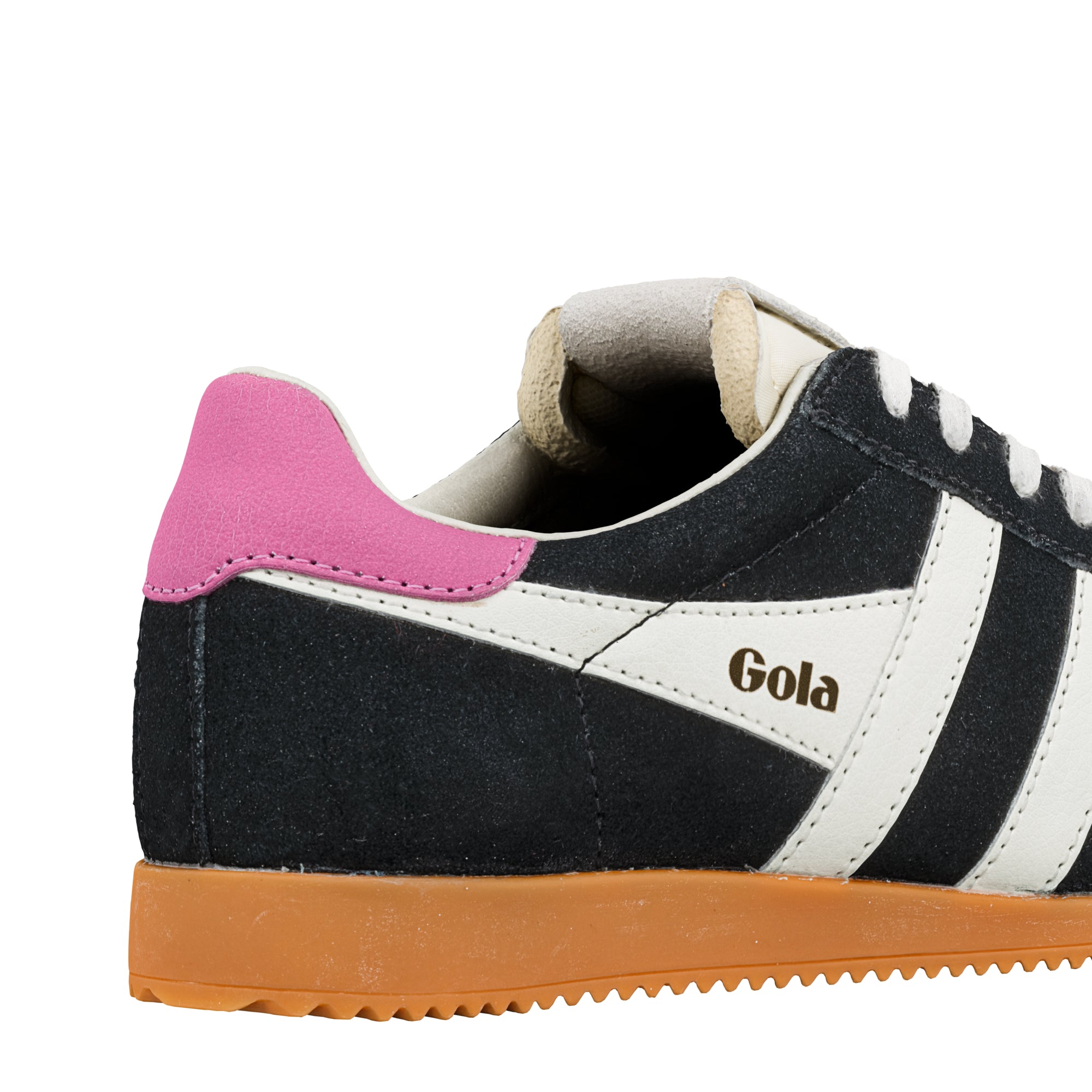 Close up of black and white Gola trainer with pink heel tab and gum sole