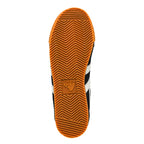 Rubber gum sole of a Gola trainer with a herringbone tread pattern
