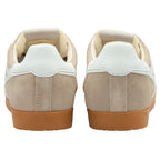 Pair of beige trainers with white soles on a white background