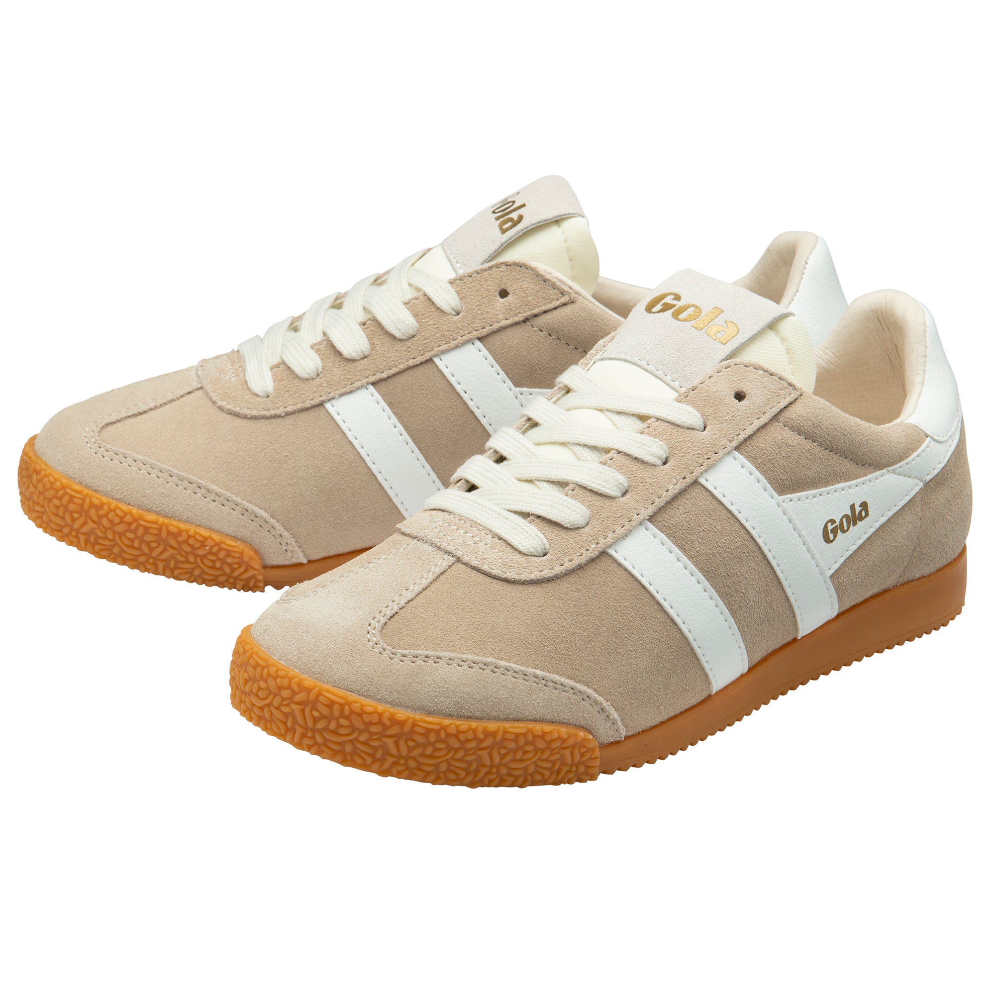 Pair of beige trainers with white stripes and brown soles on a white background