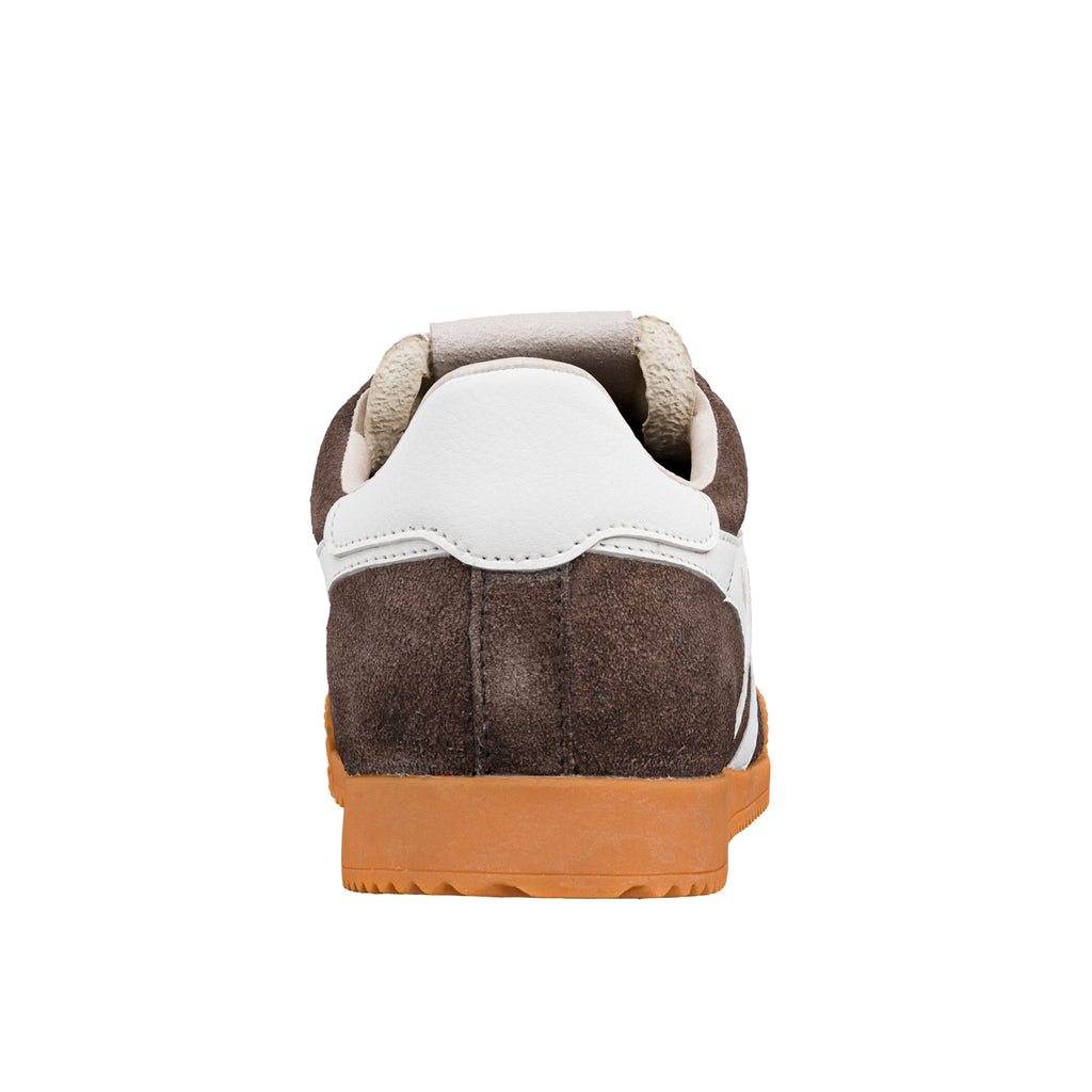 Rear view of a brown suede trainer with a white heel tab and gum rubber sole