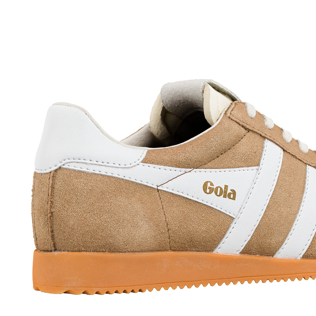 Close up of tan suede Gola trainer with white side stripes and gum sole
