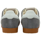 Pair of grey trainers with gum soles on a white background