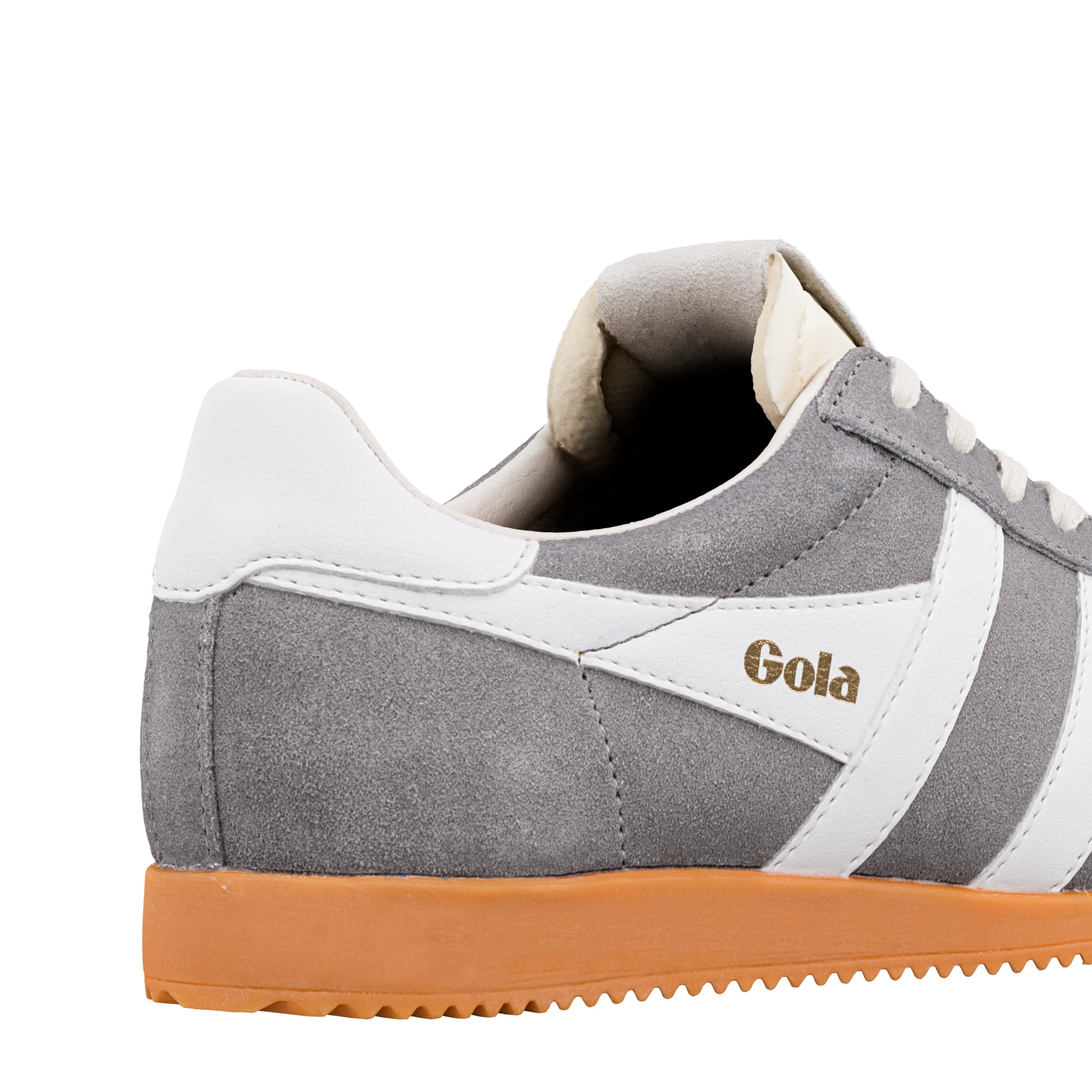 Close up of grey suede Gola trainer with white side stripes and gum sole