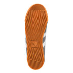 Rubber sole of a Gola trainer with a herringbone tread pattern