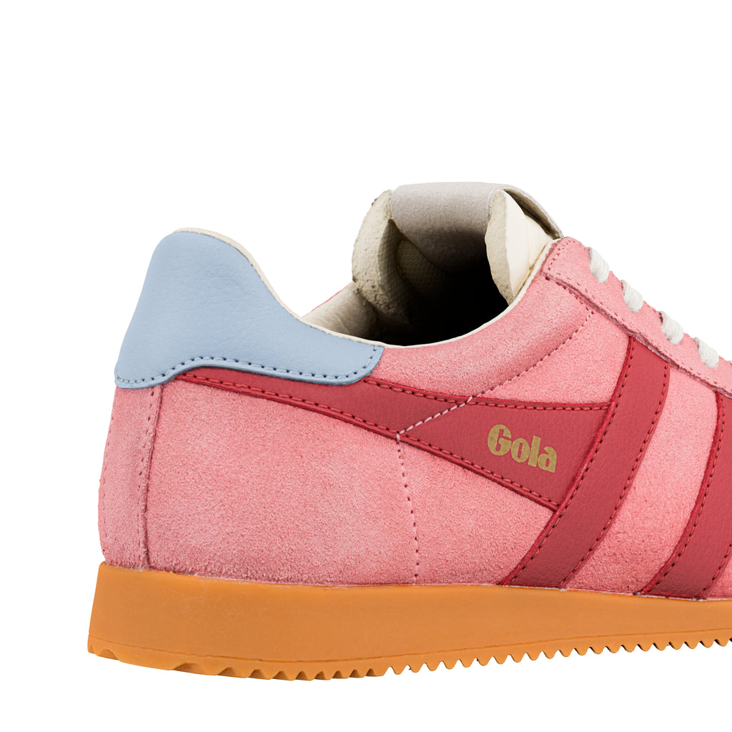 Heel detail of a pink suede Gola Classics trainer with a blue heel tab and orange sole