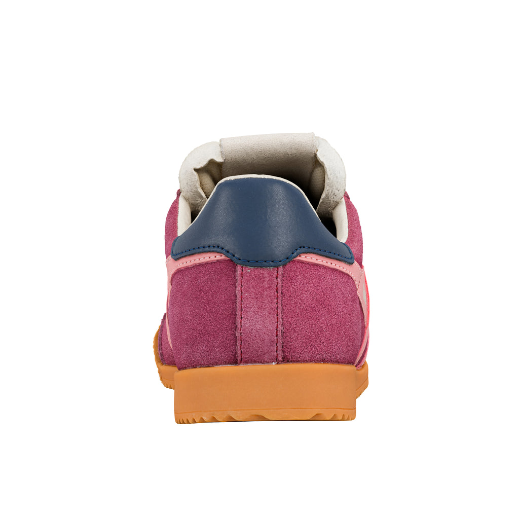 Rear view of a maroon suede trainer with a navy blue heel tab and a gum rubber sole