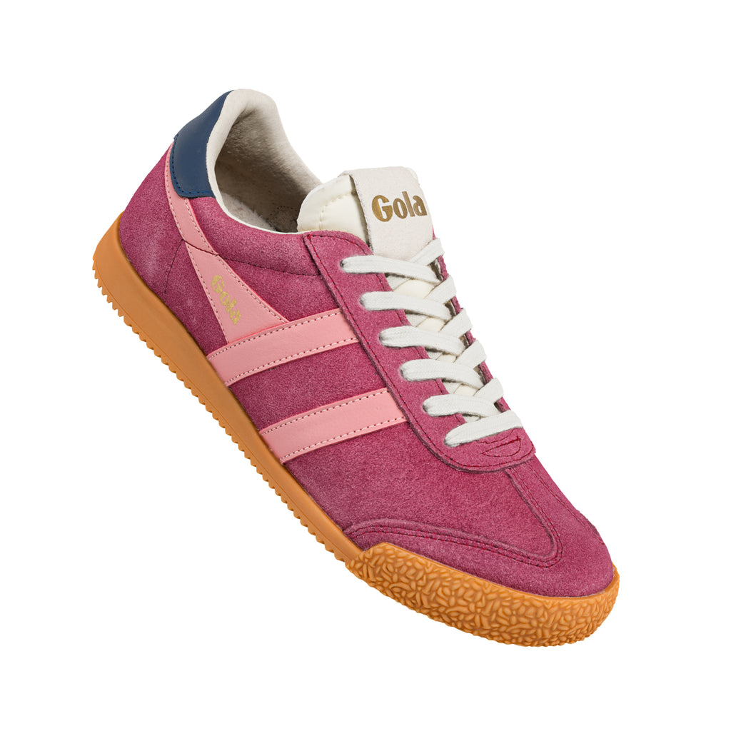 Pink suede Gola trainer with white laces and gum rubber sole