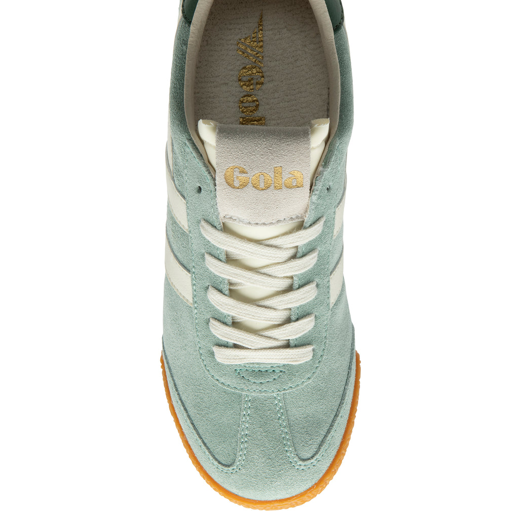 Green trainer with white laces on a white background
