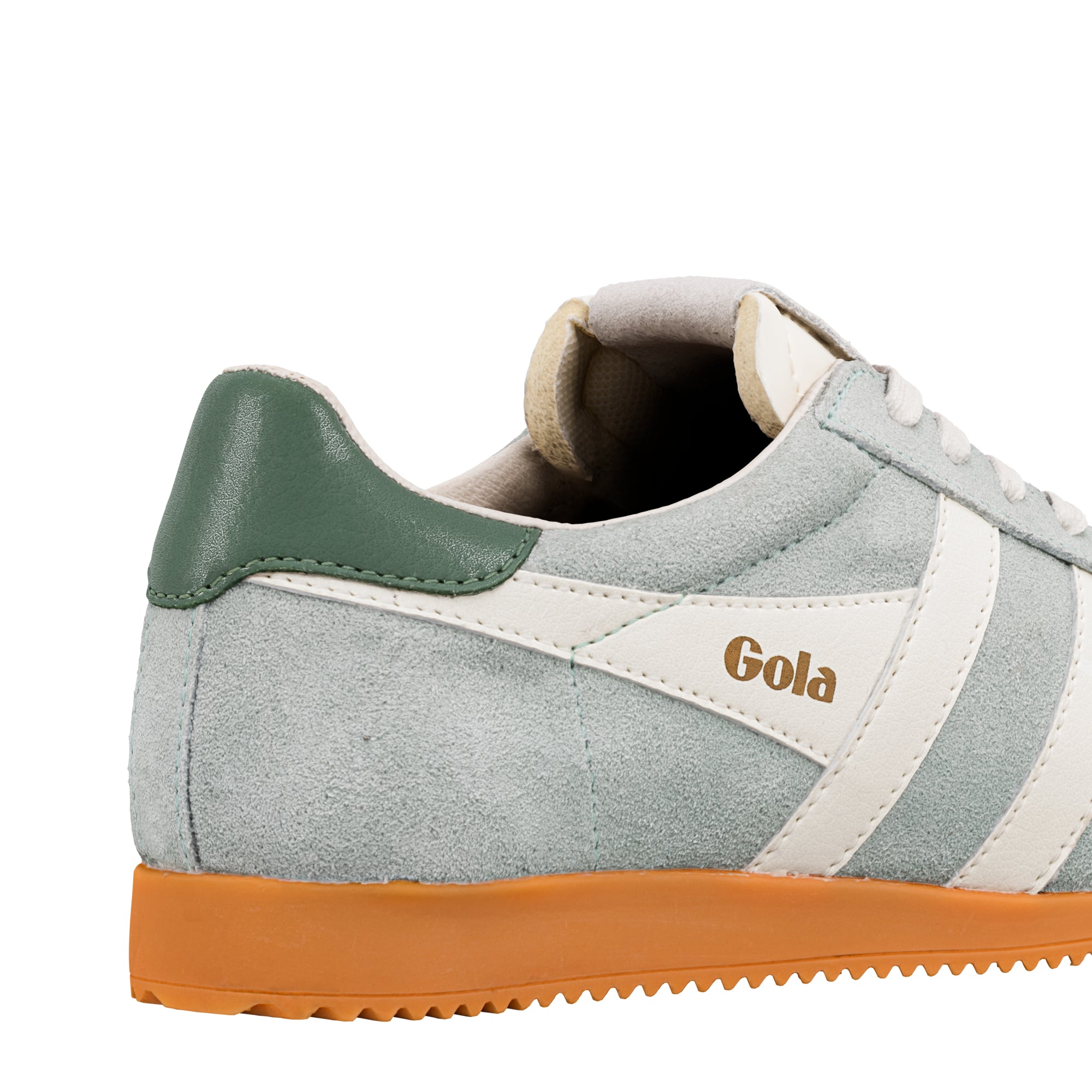 Close up of the heel and side of a light blue suede Gola trainer with a gum sole and green heel tab