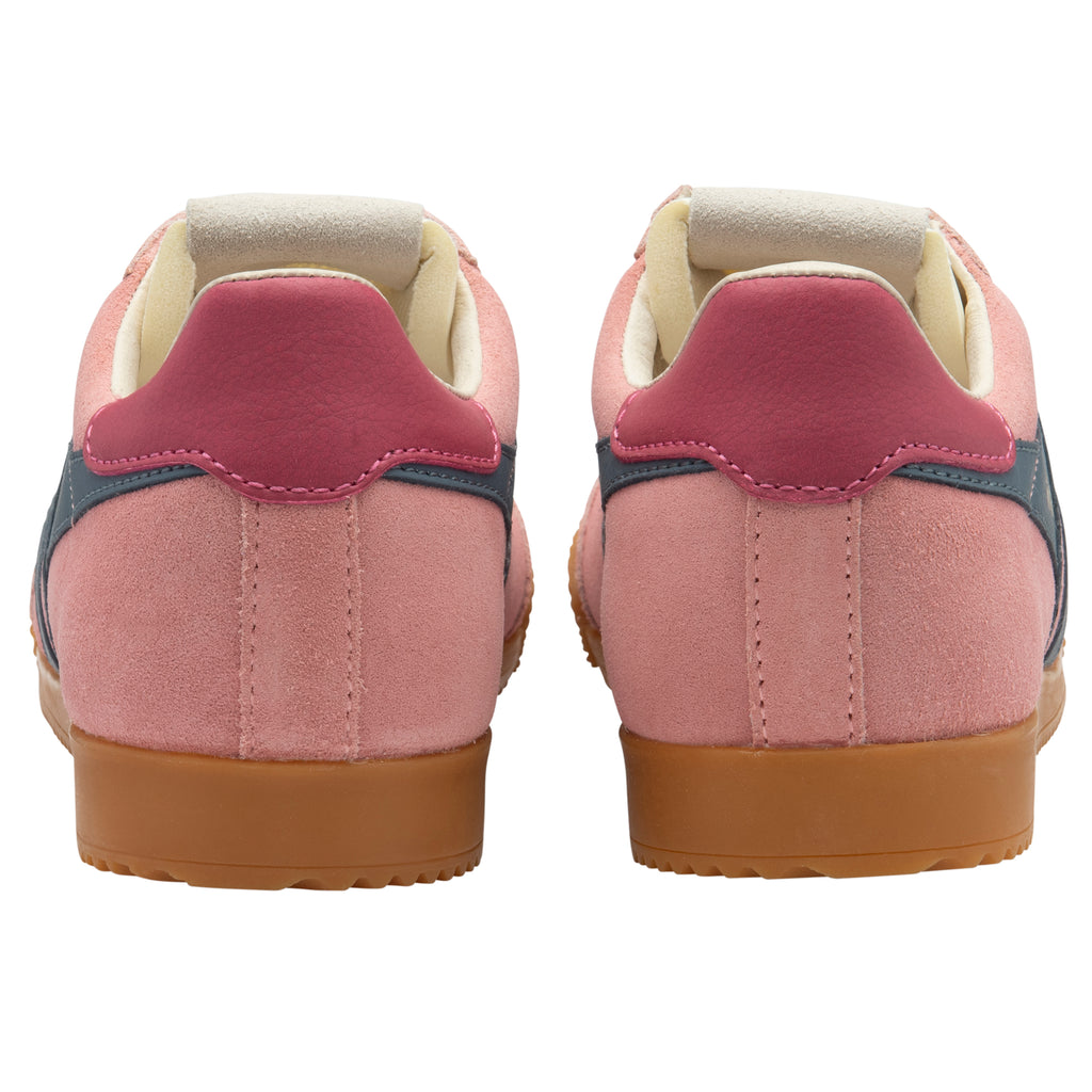 Pair of pink trainers with gum soles on a white background