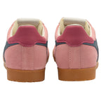 Pair of pink trainers with gum soles on a white background