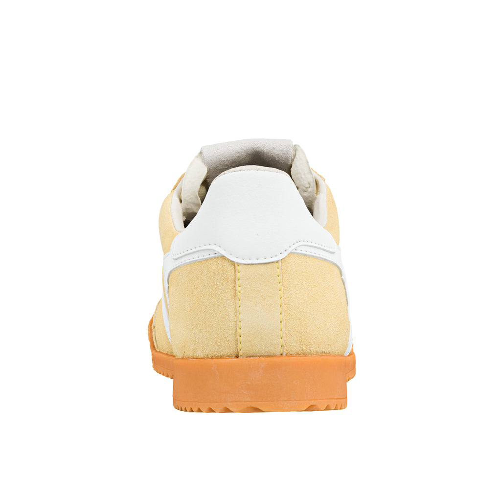 Rear view of a yellow suede Gola Classics trainer with a white heel tab and orange rubber sole