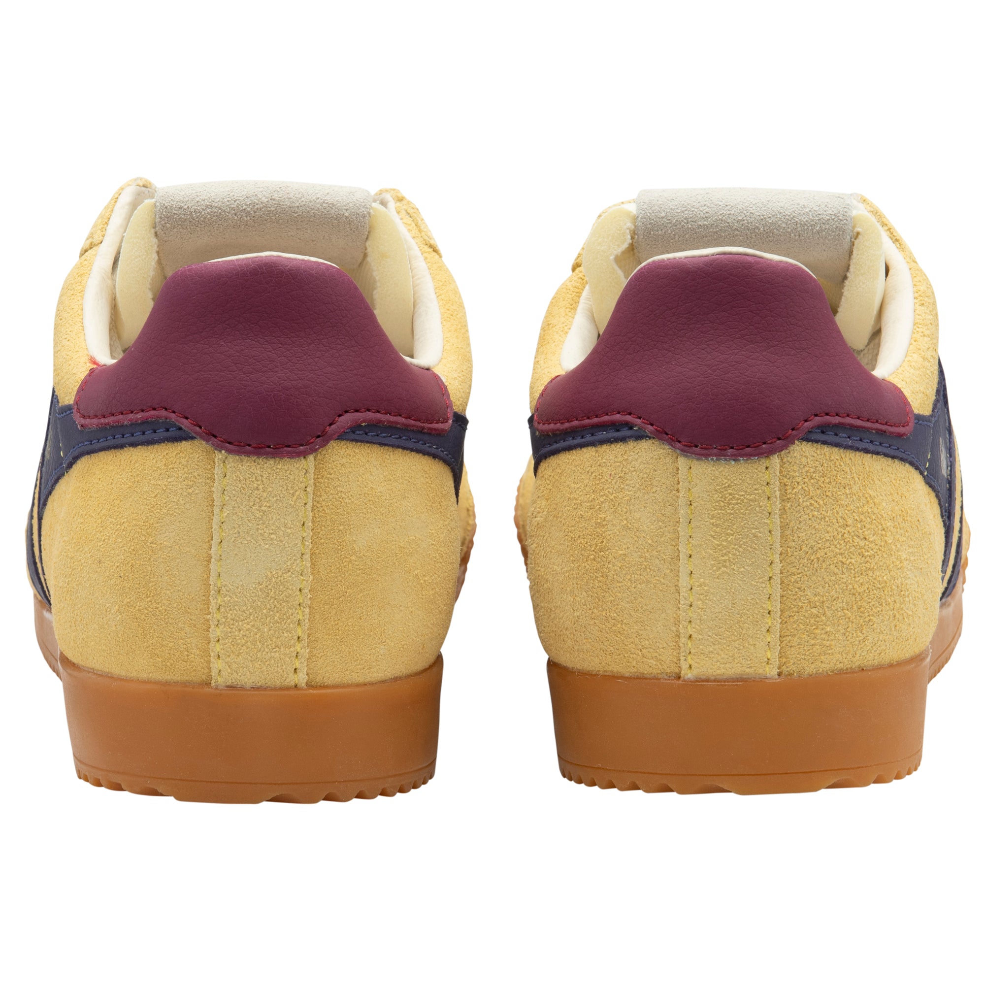 Pair of trainers with a gum sole and purple heel tab on a white background