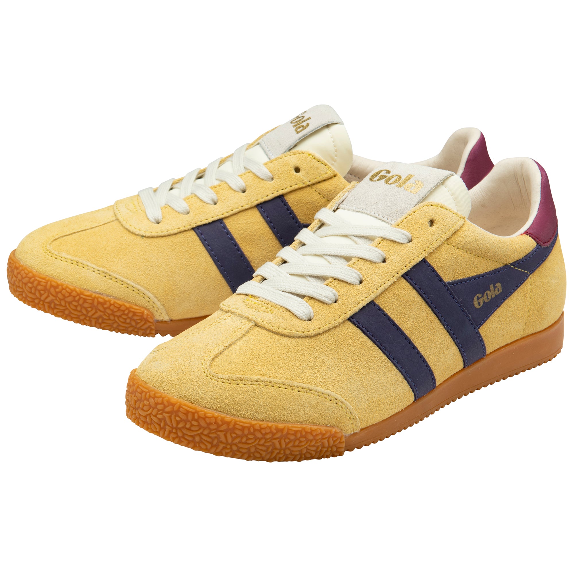 Yellow trainers with navy stripes and white laces on a white background