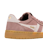 Side view of a dusty pink suede Gola trainer with a gum sole