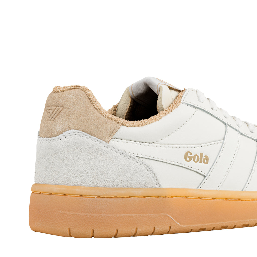 Close-up of the heel of a white Gola trainer with a tan suede trim and gum sole
