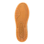 Underside of a Gola trainer with a tan sole and a zig-zag pattern