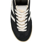 Close-up of a black Gola trainer with white stripes and cream laces