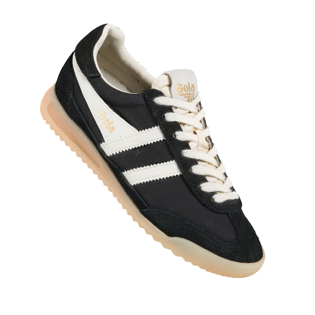 Black and white Gola trainer with a tan sole