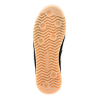Underside of a black trainer with a tan sole and Gola branding