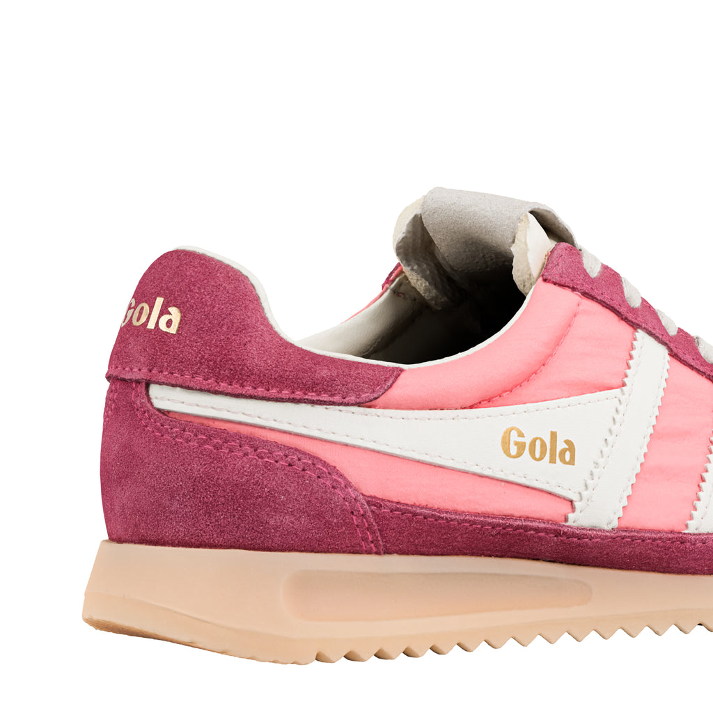 Close up of the heel of a Gola trainer in pink and burgundy with a cream sole