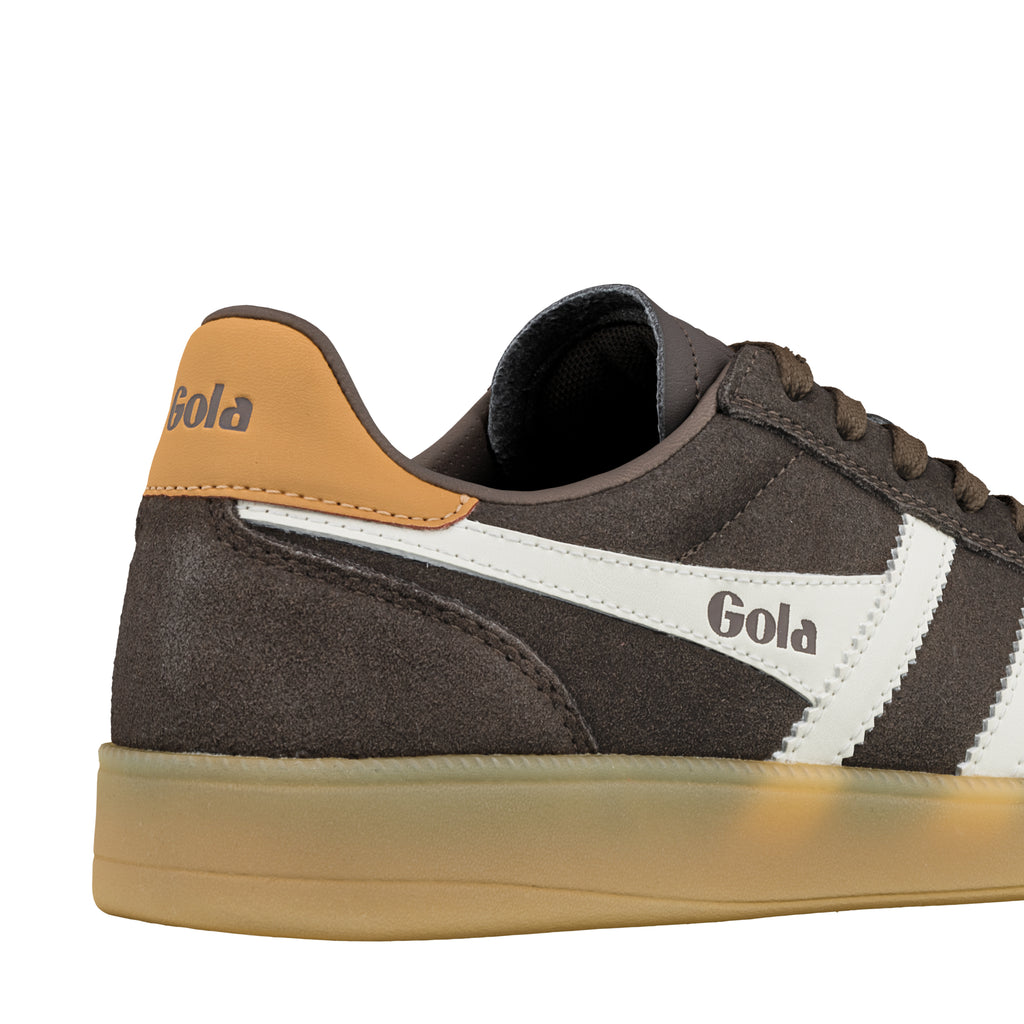 Close up of a brown suede Gola trainer with a gum sole and white side branding