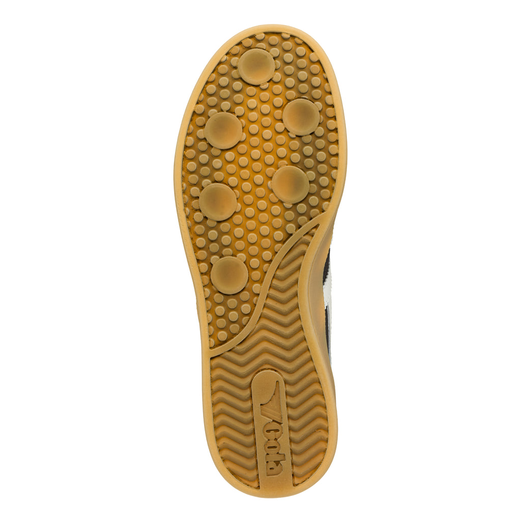 Gum rubber trainer sole with circular tread pattern and Gola branding