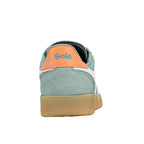 Rear view of a sage green suede Gola trainer with an orange heel tab and gum sole