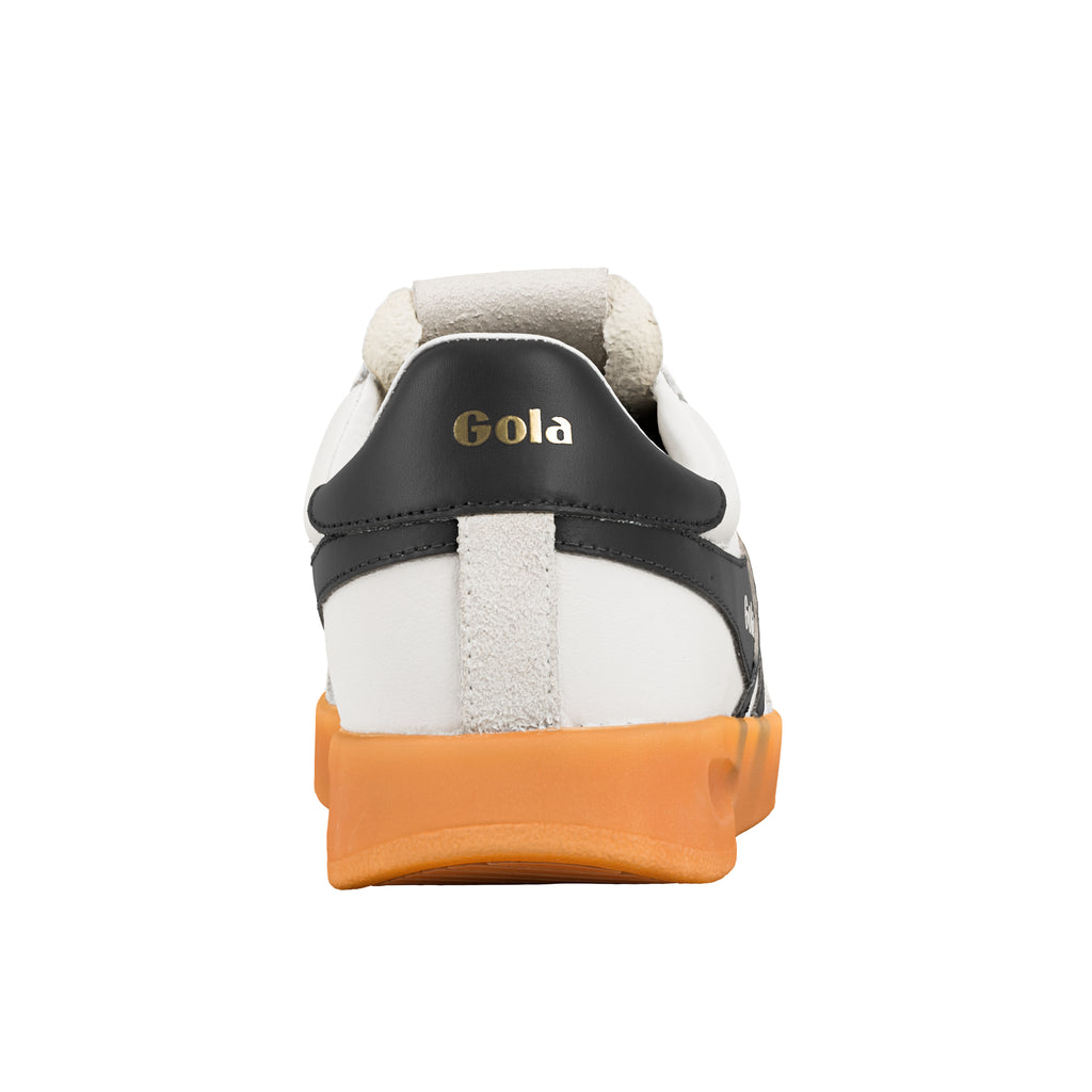 Rear view of a white Gola trainer with a black heel tab and orange gum sole