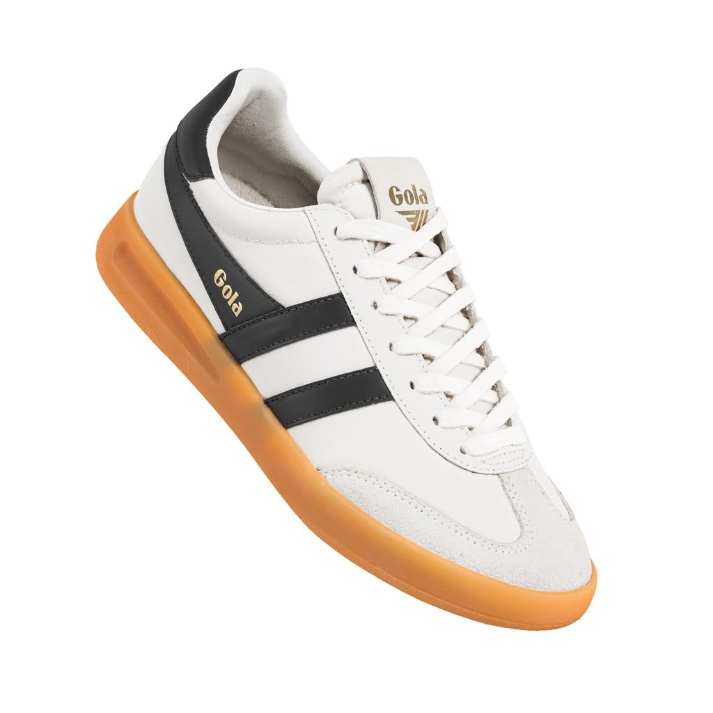 White Gola trainer with black side stripes and a gum rubber sole